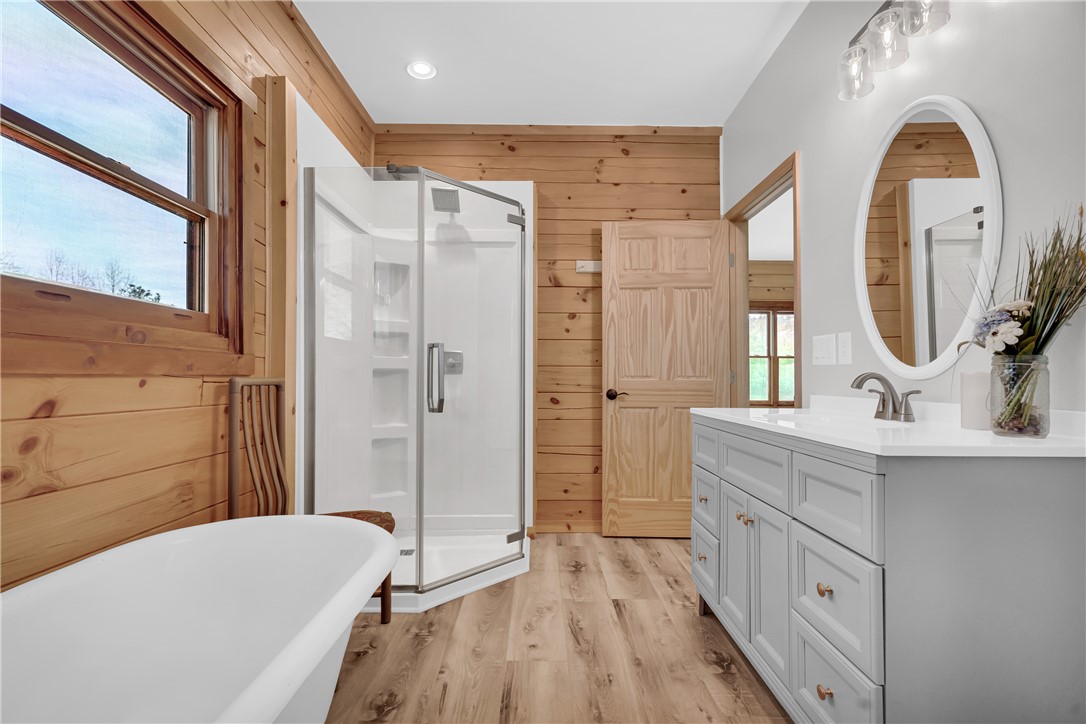 239 North Little River Road Salem, SC 29676 - Photo 31 of 43 This bright bathroom features a standalone tub and a glass-enclosed shower, perfect for unwinding.