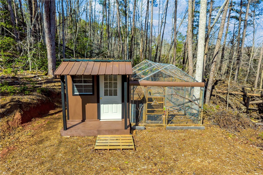 239 North Little River Road Salem, SC 29676 - Photo 35 of 43 This charming shed and greenhouse combination offers a dedicated space for gardening and storage.