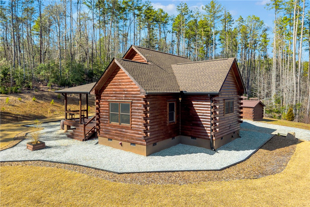 239 North Little River Road Salem, SC 29676 - Photo 10 of 43 This charming cabin home offers a serene escape, surrounded by towering trees and natural beauty.