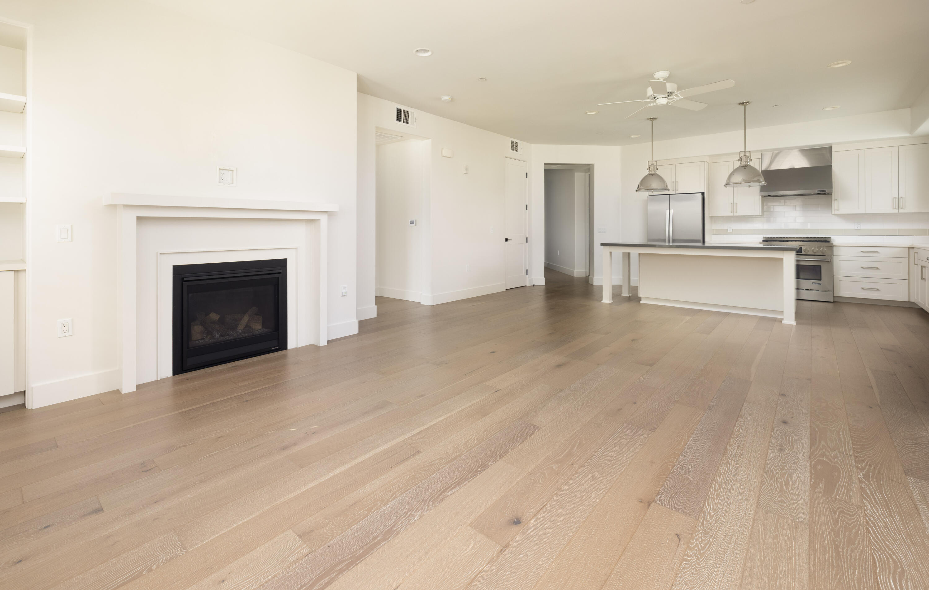 3726 State Street, Unit 203 Santa Barbara, CA 93105 - Photo 13 of 30 a view of kitchen with kitchen island wooden cabinets and refrigerator