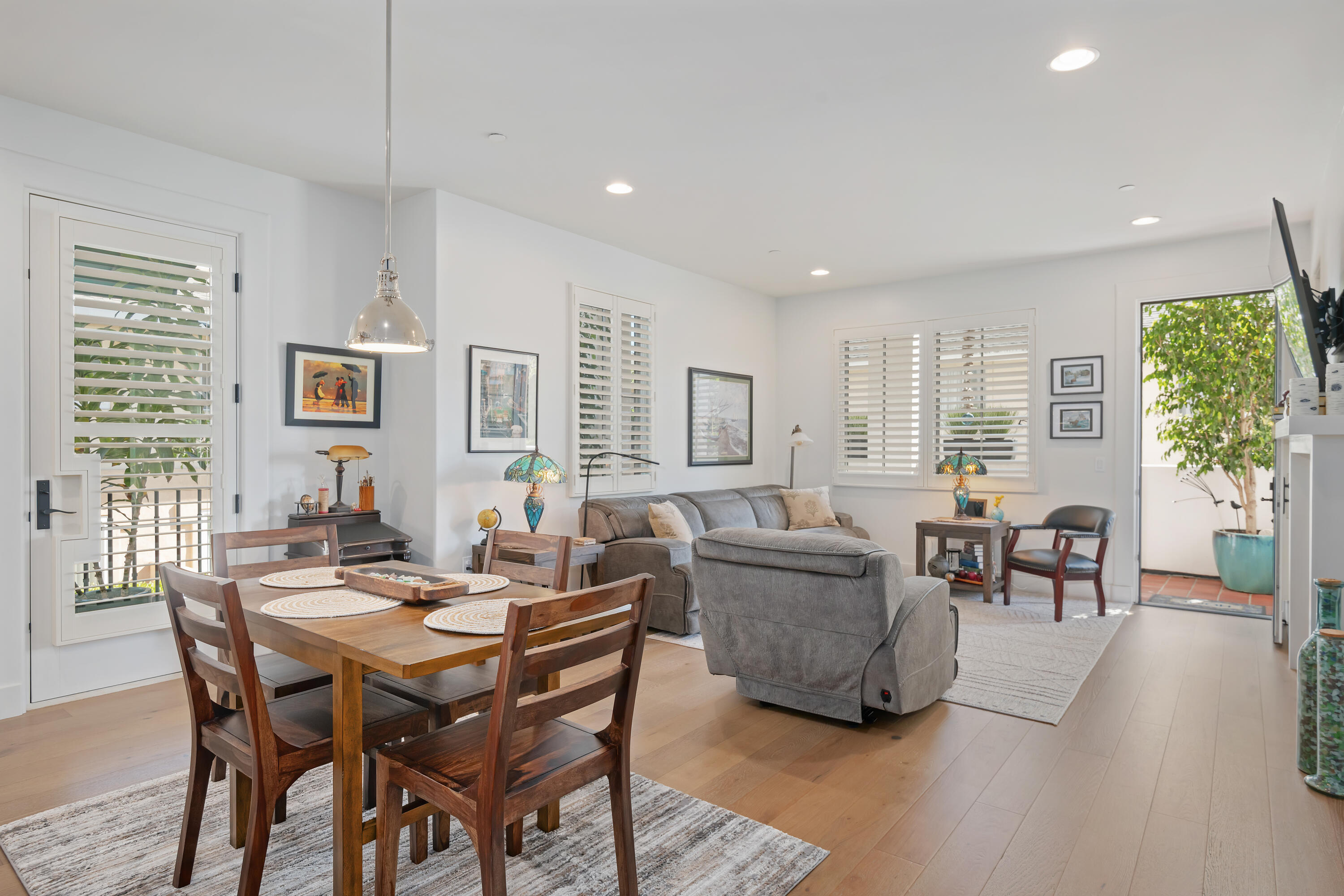 3726 State Street, Unit 203 Santa Barbara, CA 93105 - Photo 7 of 30 a view of a dining room with furniture window and wooden floor