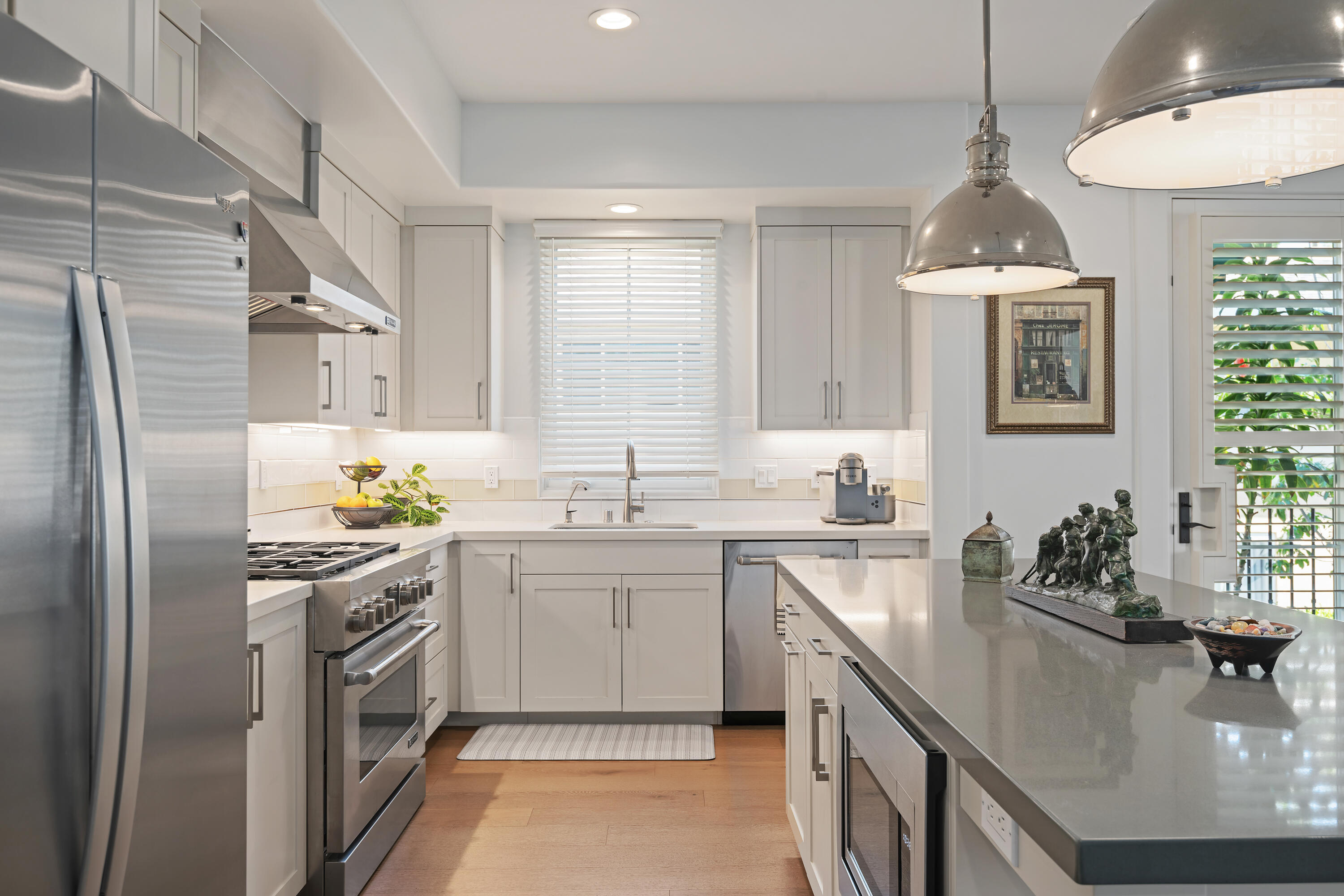 3726 State Street, Unit 203 Santa Barbara, CA 93105 - Photo 8 of 30 a kitchen with stainless steel appliances a sink stove and cabinets