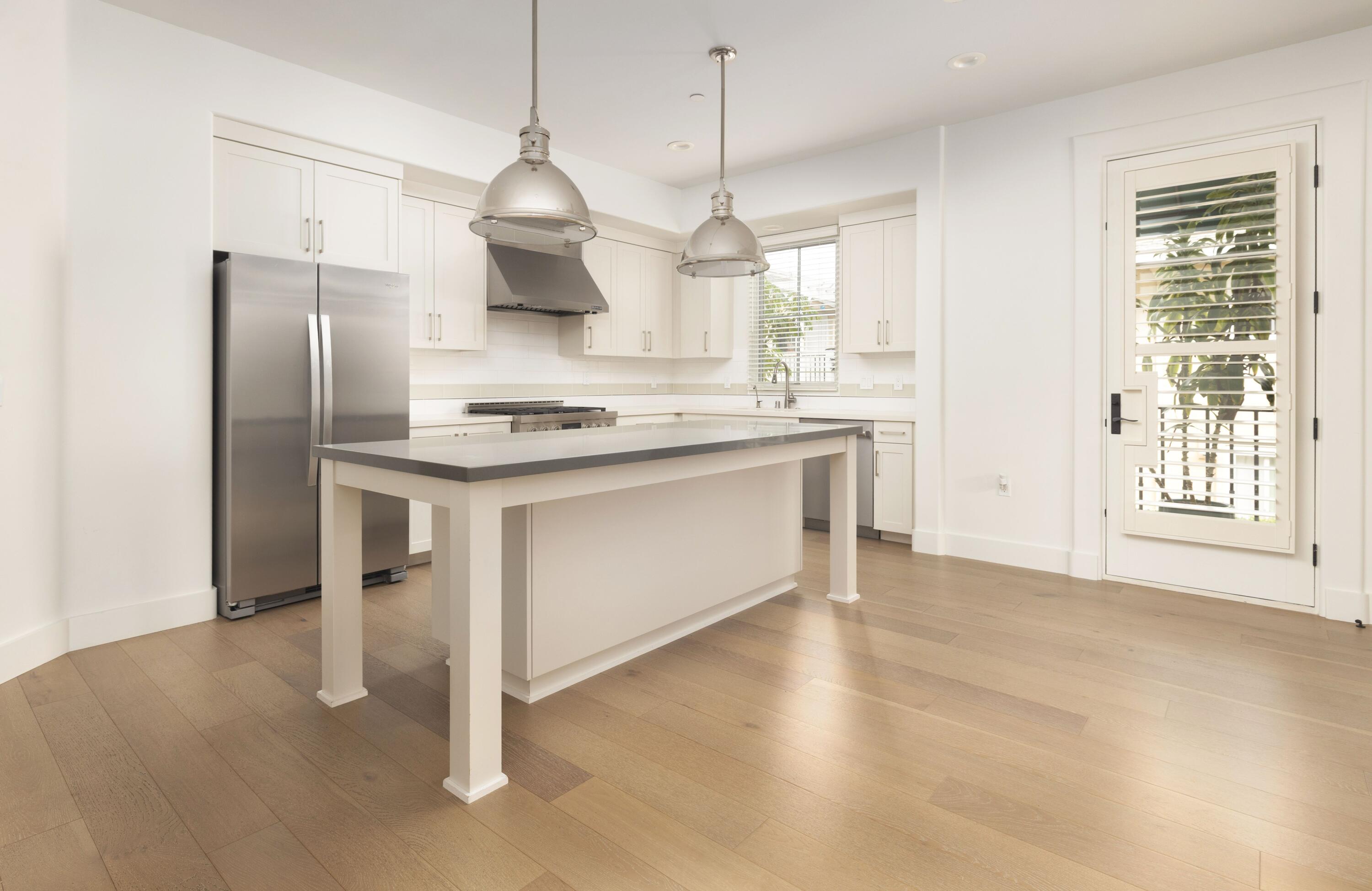 3726 State Street, Unit 203 Santa Barbara, CA 93105 - Photo 10 of 30 a kitchen with stainless steel appliances granite countertop a stove a sink and a refrigerator