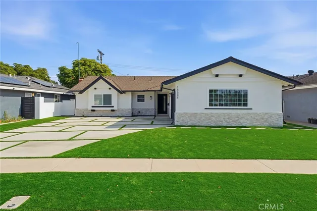 a view of front of house with a yard