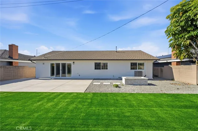 a front view of house with yard outdoor seating and barbeque oven