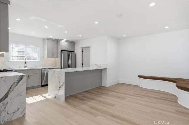 a kitchen with a sink cabinets and window