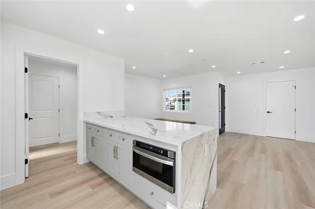 a kitchen with a stove and a sink