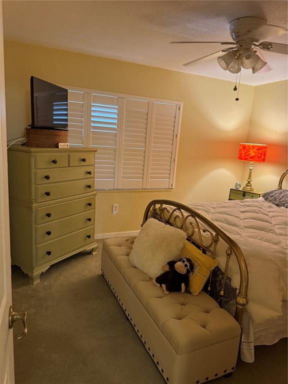 23465 Harbor View Road, Unit 244 Punta Gorda, FL 33980 - Photo 13 of 61 a bed sitting in a bedroom and dresser next to a window