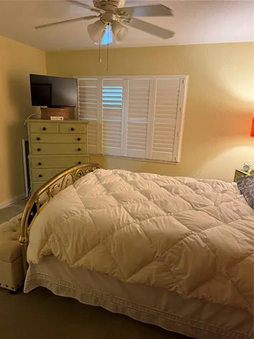 a bathroom with a sink mirror vanity and toilet