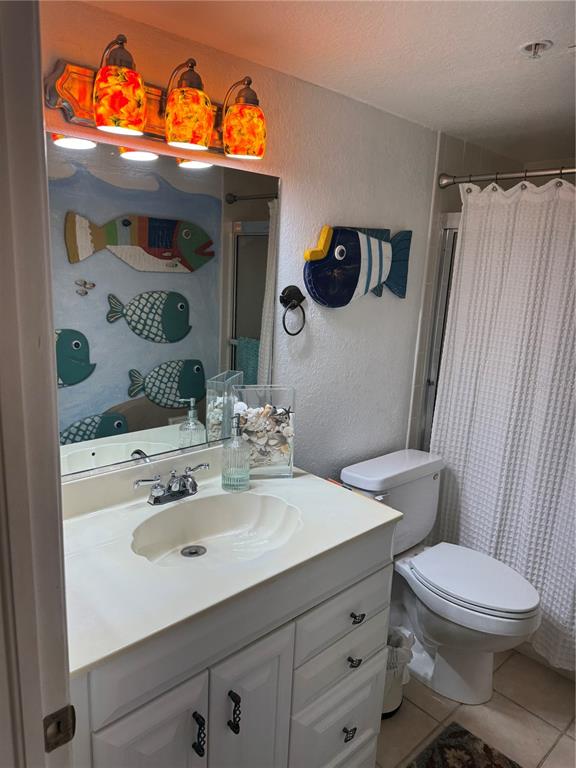 23465 Harbor View Road, Unit 244 Punta Gorda, FL 33980 - Photo 18 of 61 a bathroom with a sink mirror vanity and toilet