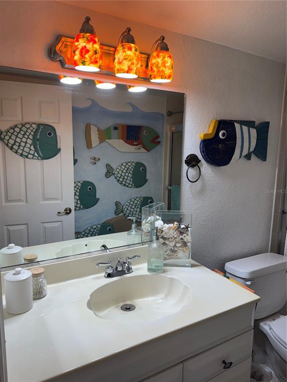 23465 Harbor View Road, Unit 244 Punta Gorda, FL 33980 - Photo 19 of 61 a bathroom with a sink and mirror