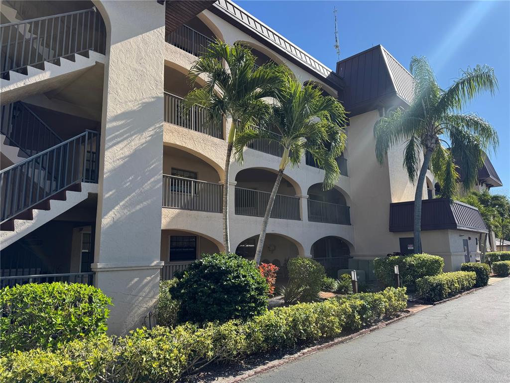 23465 Harbor View Road, Unit 244 Punta Gorda, FL 33980 - Photo 2 of 61 a house view with a garden space