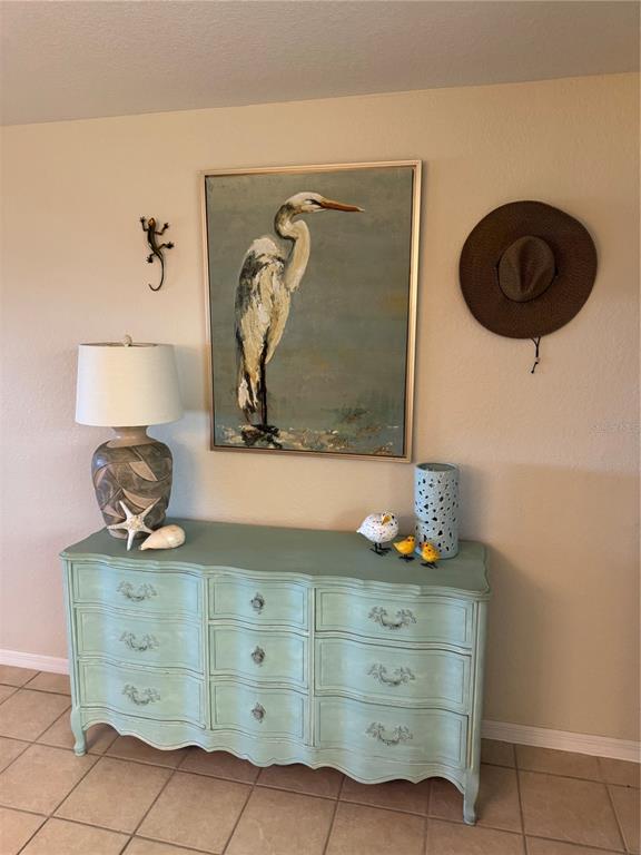 23465 Harbor View Road, Unit 244 Punta Gorda, FL 33980 - Photo 24 of 61 a bathroom with a granite countertop sink and a mirror