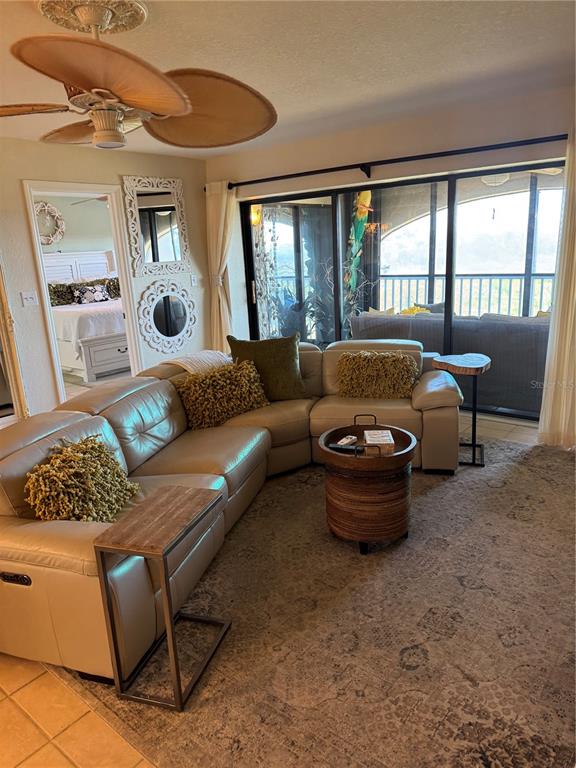 23465 Harbor View Road, Unit 244 Punta Gorda, FL 33980 - Photo 26 of 61 a living room with furniture and a large window