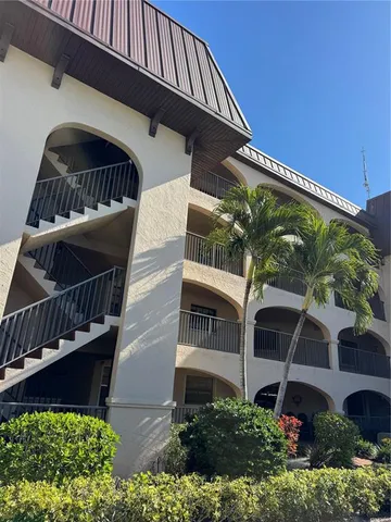 a kitchen with a table and chairs in it