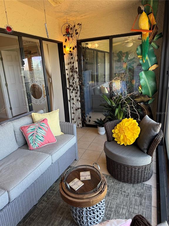 23465 Harbor View Road, Unit 244 Punta Gorda, FL 33980 - Photo 36 of 61 a living room with furniture and a fireplace