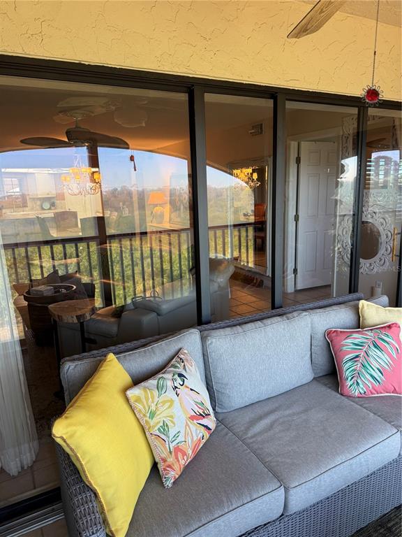 23465 Harbor View Road, Unit 244 Punta Gorda, FL 33980 - Photo 38 of 61 a balcony with furniture and a potted plant