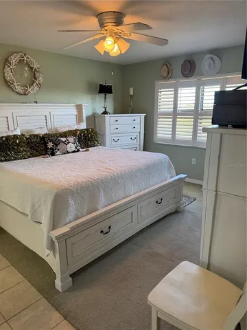 a spacious bathroom with double sink and mirror