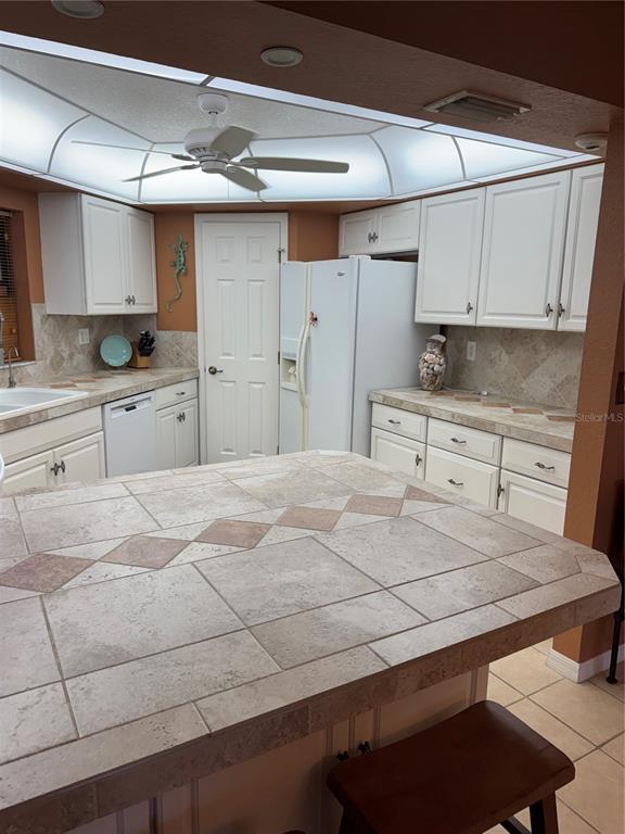 23465 Harbor View Road, Unit 244 Punta Gorda, FL 33980 - Photo 5 of 61 a bedroom with a bed and a dresser