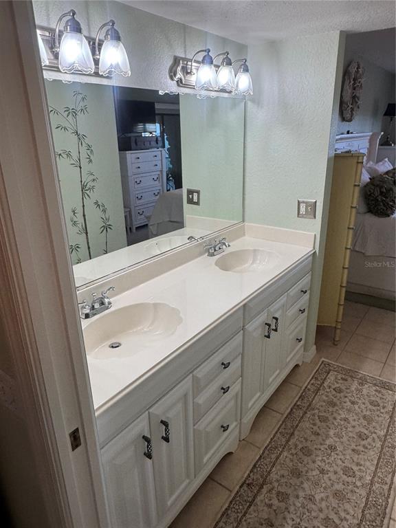 23465 Harbor View Road, Unit 244 Punta Gorda, FL 33980 - Photo 58 of 61 a bathroom with a sink double vanity and a mirror