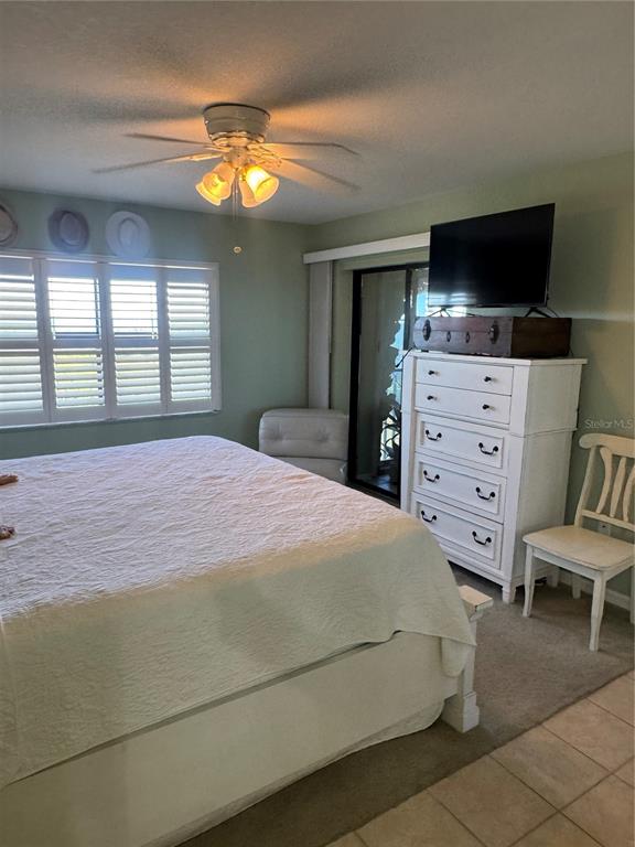 23465 Harbor View Road, Unit 244 Punta Gorda, FL 33980 - Photo 61 of 61 a bedroom with a bed and a flat screen tv