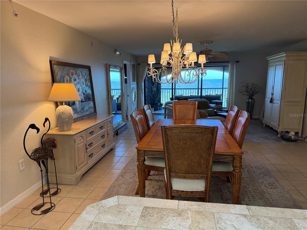 23465 Harbor View Road, Unit 244 Punta Gorda, FL 33980 - Photo 9 of 61 a view of a dining room with furniture and chandelier
