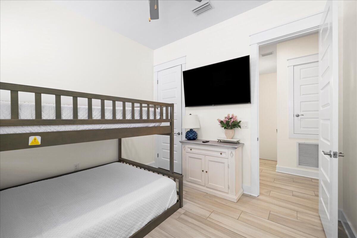 73 Dune Comet Lane, Unit B Inlet Beach, FL 32461 - Photo 15 of 25 a bedroom with a bed and a flat screen tv