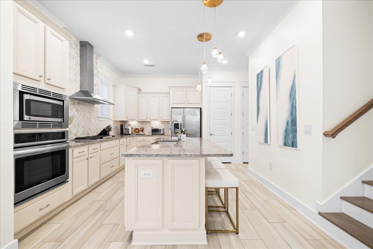 73 Dune Comet Lane, Unit B Inlet Beach, FL 32461 - Photo 2 of 25 a kitchen with stainless steel appliances granite countertop a stove a sink and a refrigerator