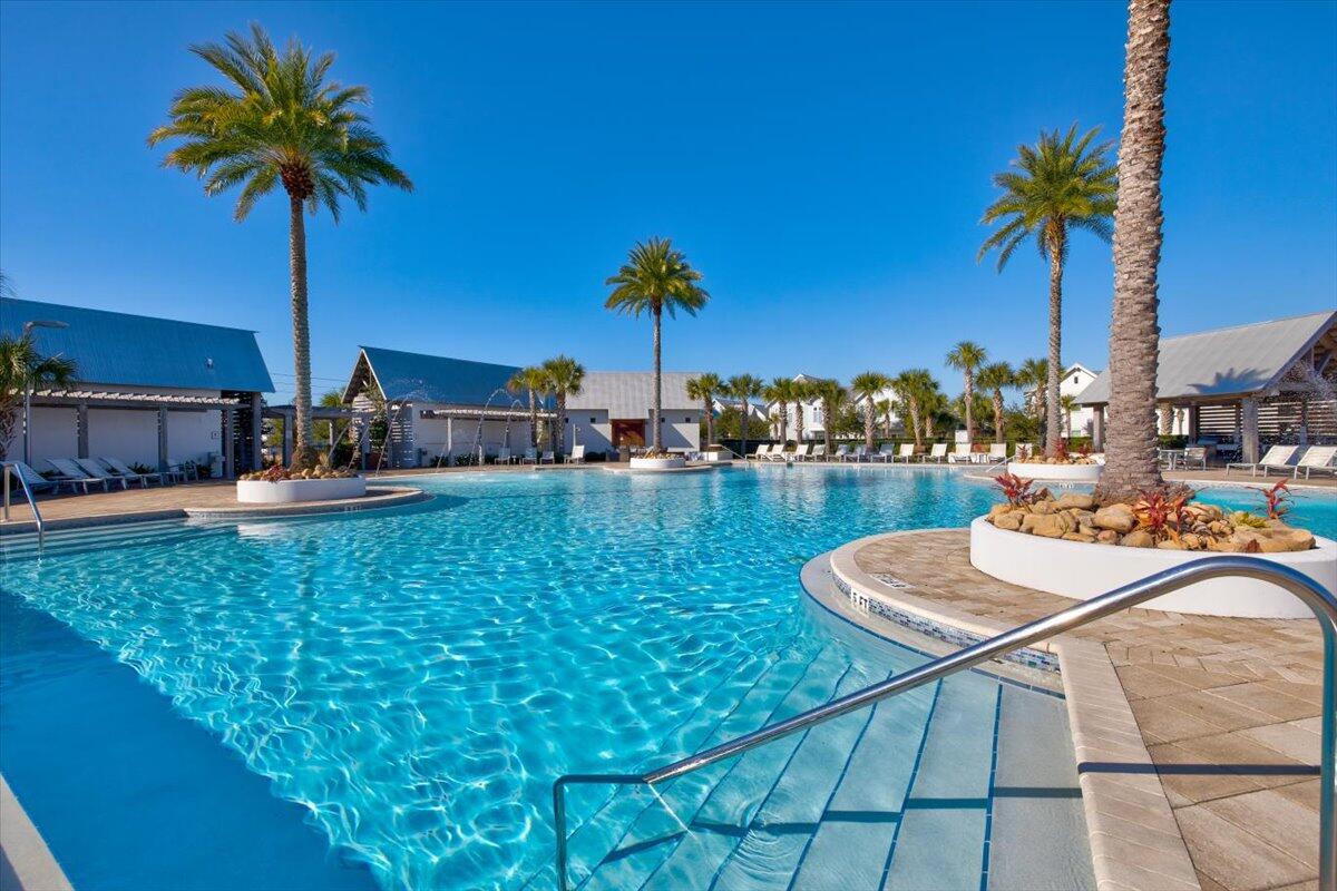 73 Dune Comet Lane, Unit B Inlet Beach, FL 32461 - Photo 25 of 25 a view of a swimming pool with a table and chairs