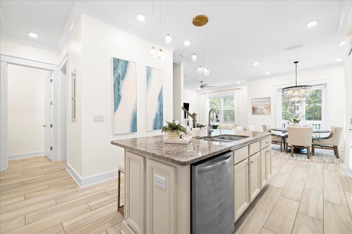 73 Dune Comet Lane, Unit B Inlet Beach, FL 32461 - Photo 3 of 25 a kitchen with stainless steel appliances granite countertop a sink and a wooden floor
