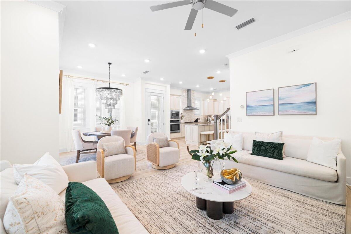 73 Dune Comet Lane, Unit B Inlet Beach, FL 32461 - Photo 6 of 25 a living room with furniture and a chandelier