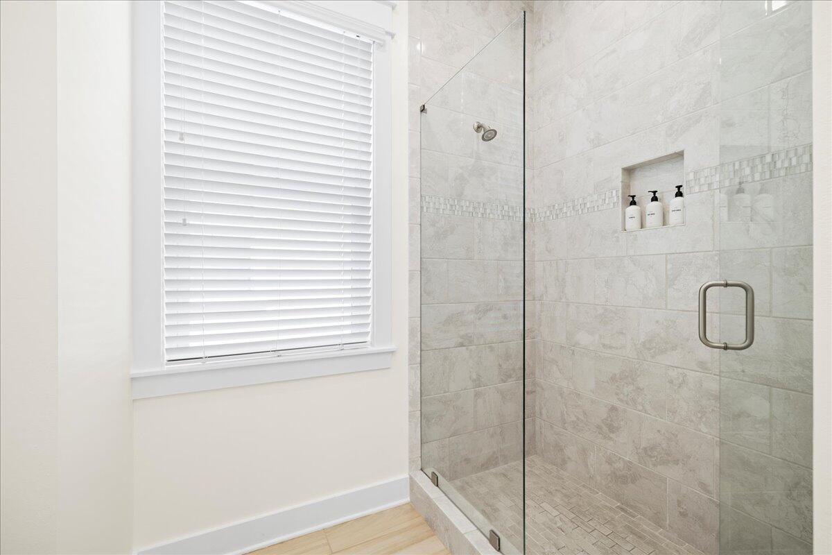 73 Dune Comet Lane, Unit B Inlet Beach, FL 32461 - Photo 10 of 25 a bathroom with a glass shower door