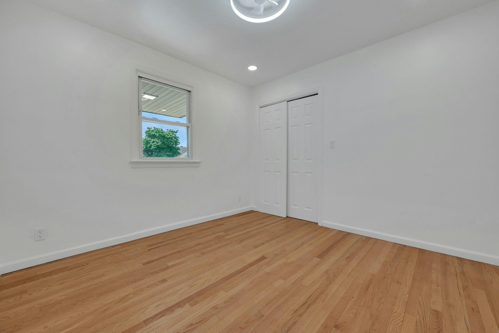 17 Arn Terrace Secaucus, NJ 07094 - Photo 20 of 34 a view of an empty room with wooden floor and a window