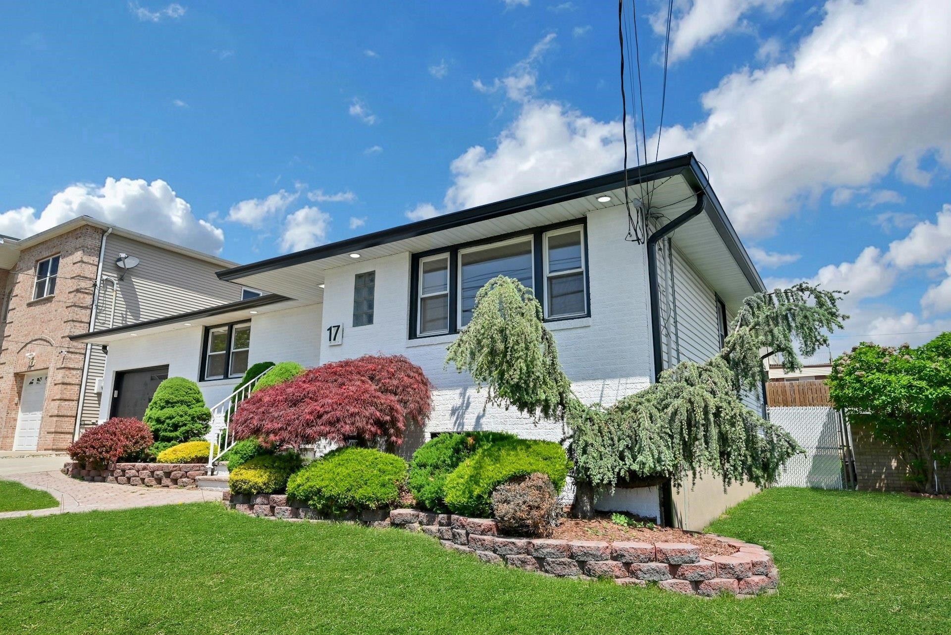 17 Arn Terrace Secaucus, NJ 07094 - Photo 2 of 34 a front view of house with yard and outdoor seating