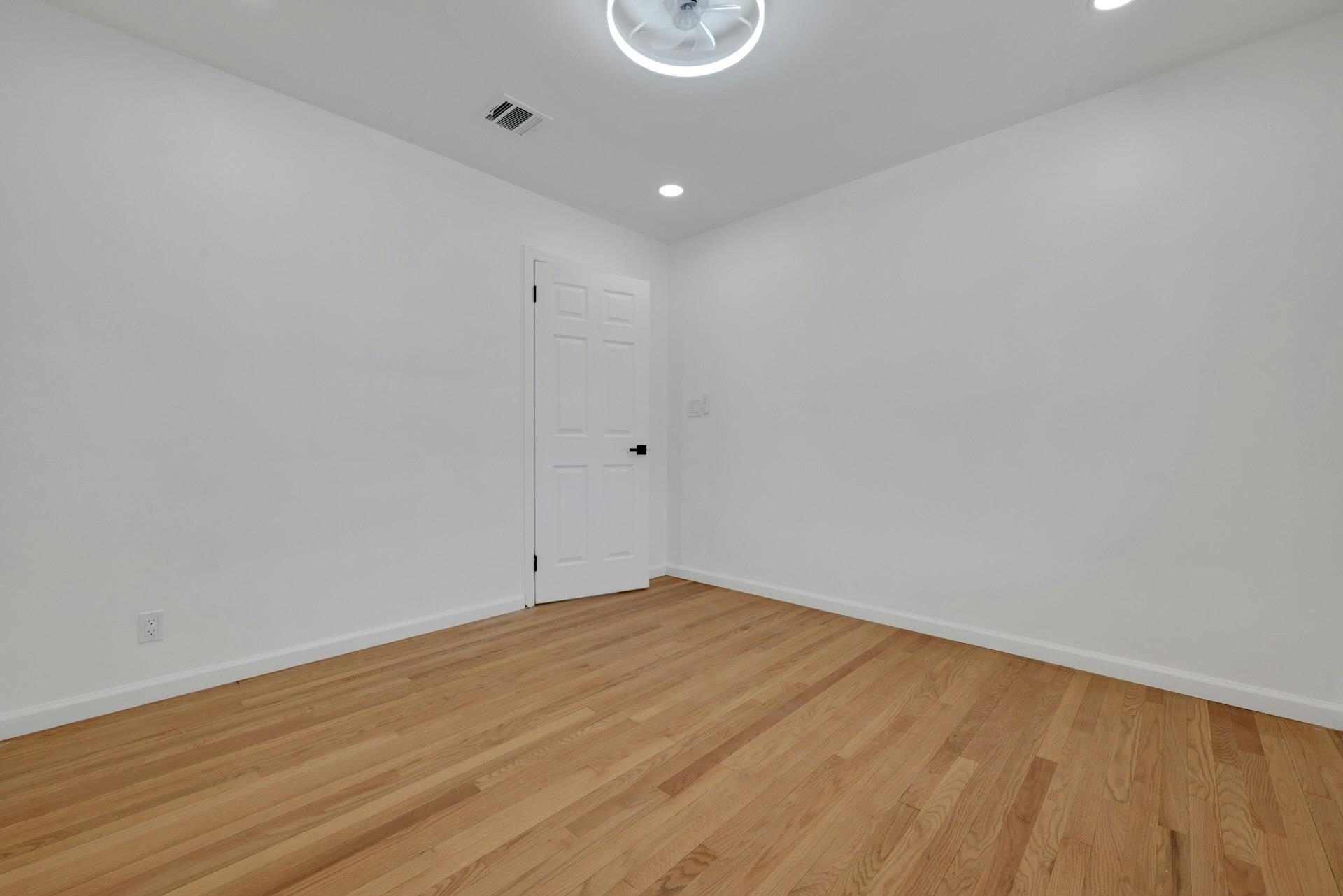 17 Arn Terrace Secaucus, NJ 07094 - Photo 21 of 34 a view of an empty room with wooden floor and a window
