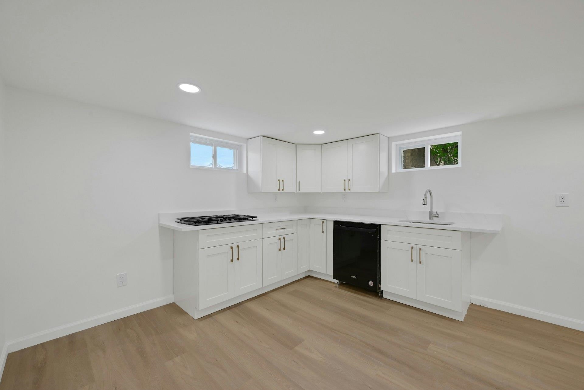 17 Arn Terrace Secaucus, NJ 07094 - Photo 24 of 34 a kitchen with granite countertop white cabinets and white appliances