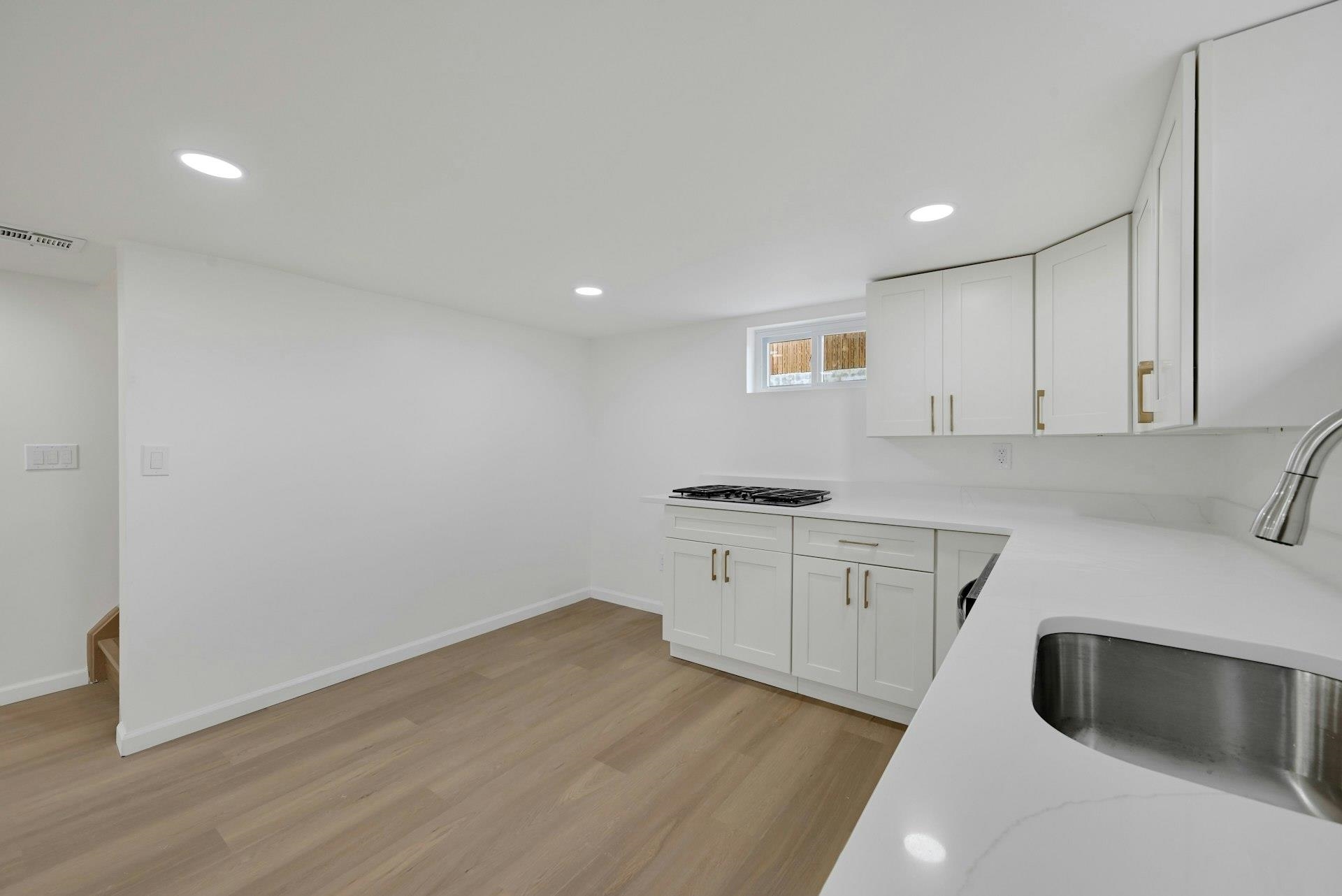 17 Arn Terrace Secaucus, NJ 07094 - Photo 25 of 34 a kitchen with granite countertop a sink and a stove top oven