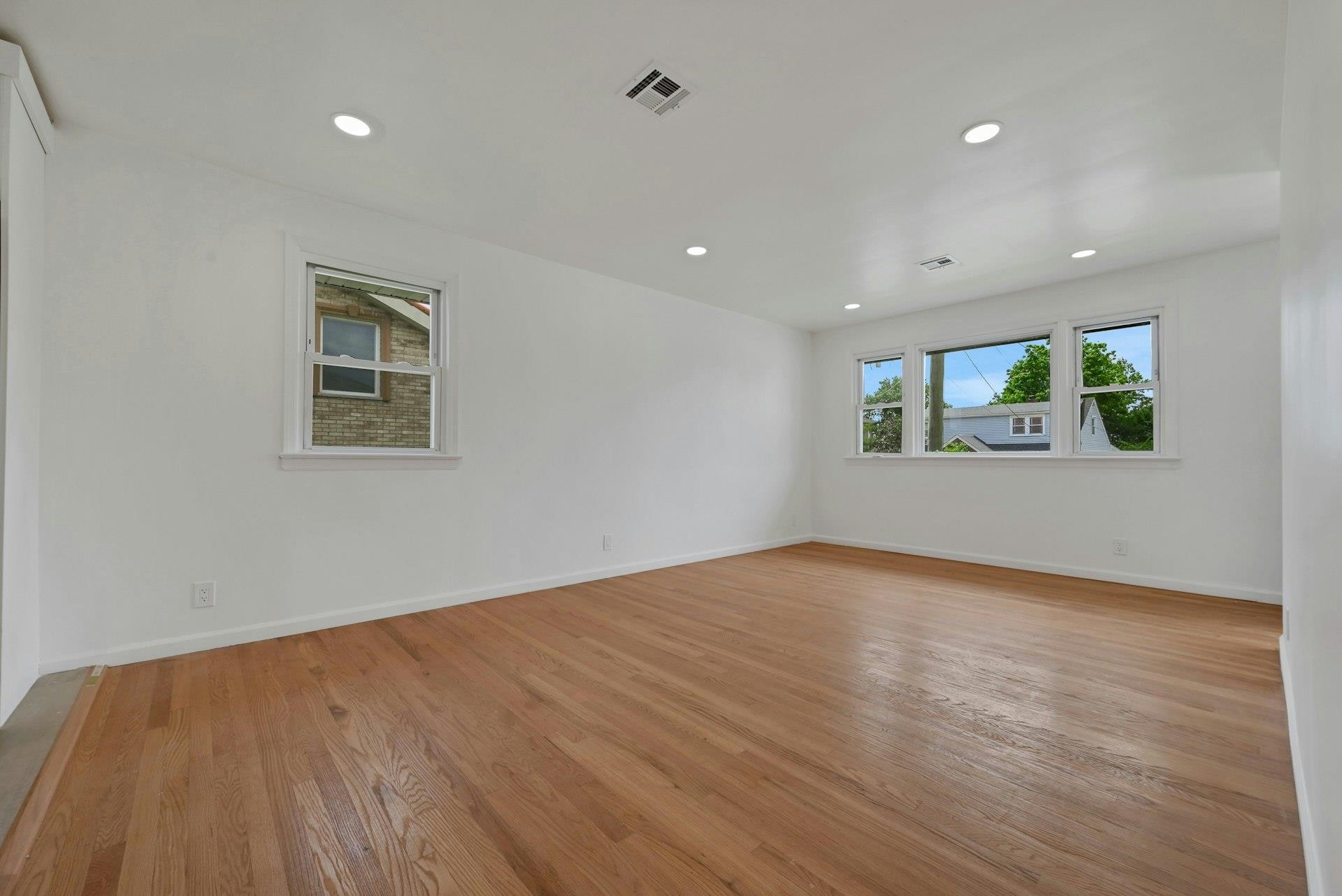 17 Arn Terrace Secaucus, NJ 07094 - Photo 7 of 34 a view of an empty room with wooden floor and a window