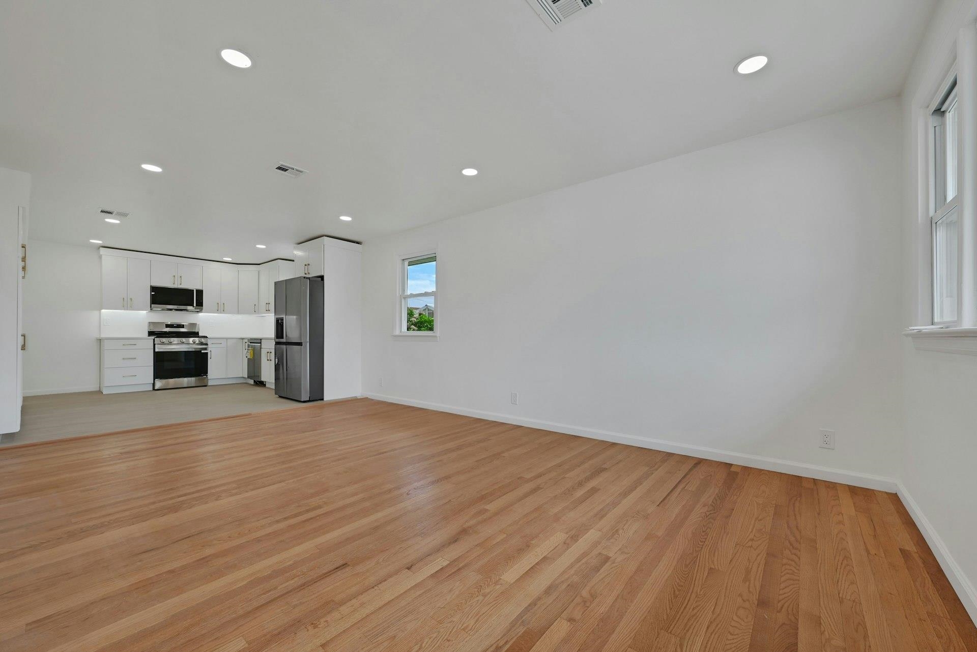17 Arn Terrace Secaucus, NJ 07094 - Photo 8 of 34 a view of empty room with wooden floor and window