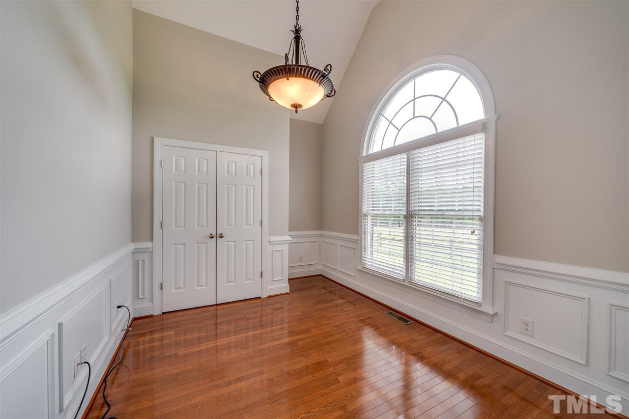 1760 Pilot-Riley Road Zebulon, NC 27597 - Photo 14 of 30 a view of empty room with wooden floor and fan