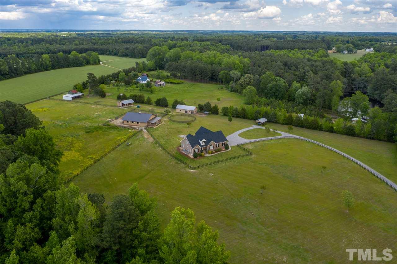 1760 Pilot-Riley Road Zebulon, NC 27597 - Photo 3 of 30 a view of a lake with a yard
