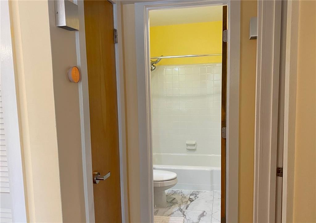 181 Powell Street Southeast, Unit 2 Atlanta, GA 30316 - Photo 14 of 47 a bathroom with a shower and a toilet