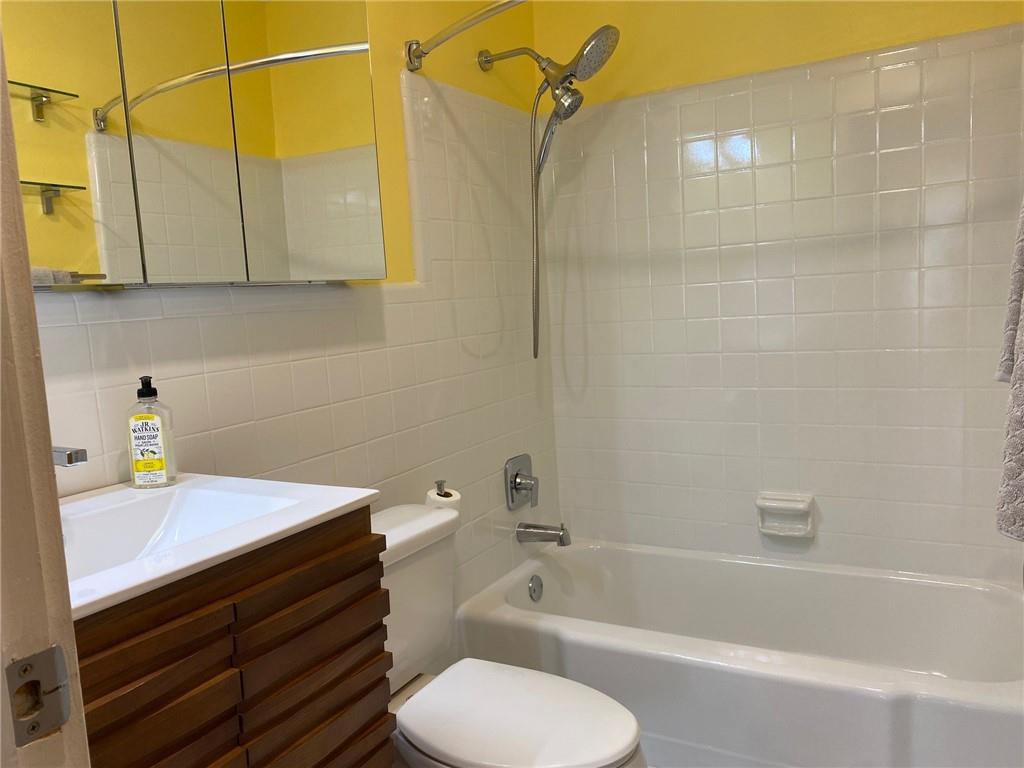 181 Powell Street Southeast, Unit 2 Atlanta, GA 30316 - Photo 15 of 47 a bathroom with a sink a toilet and shower