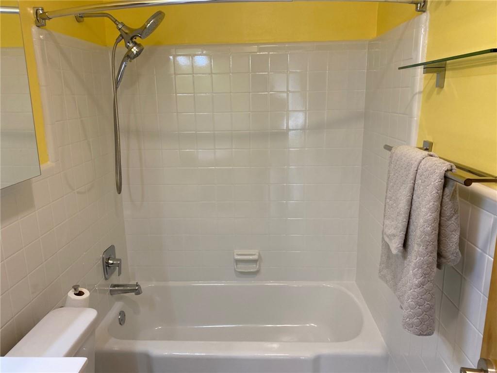 181 Powell Street Southeast, Unit 2 Atlanta, GA 30316 - Photo 17 of 47 a bathroom with a bath tub with a shower