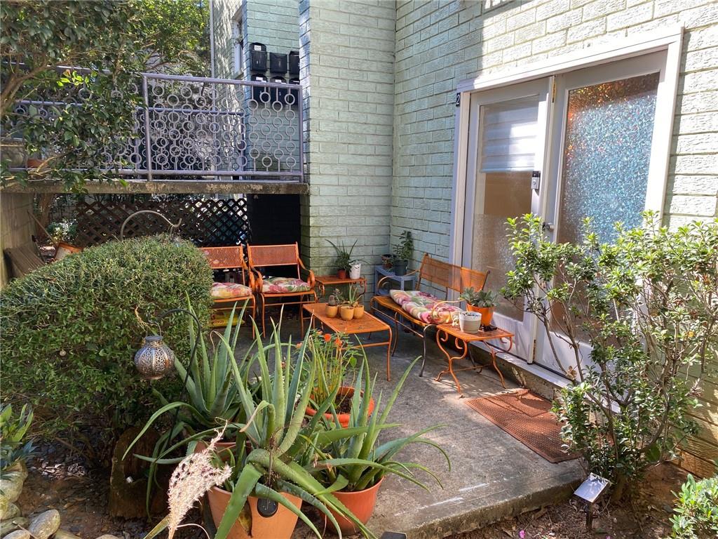 181 Powell Street Southeast, Unit 2 Atlanta, GA 30316 - Photo 28 of 47 an aerial view of a house with swimming pool and sitting area