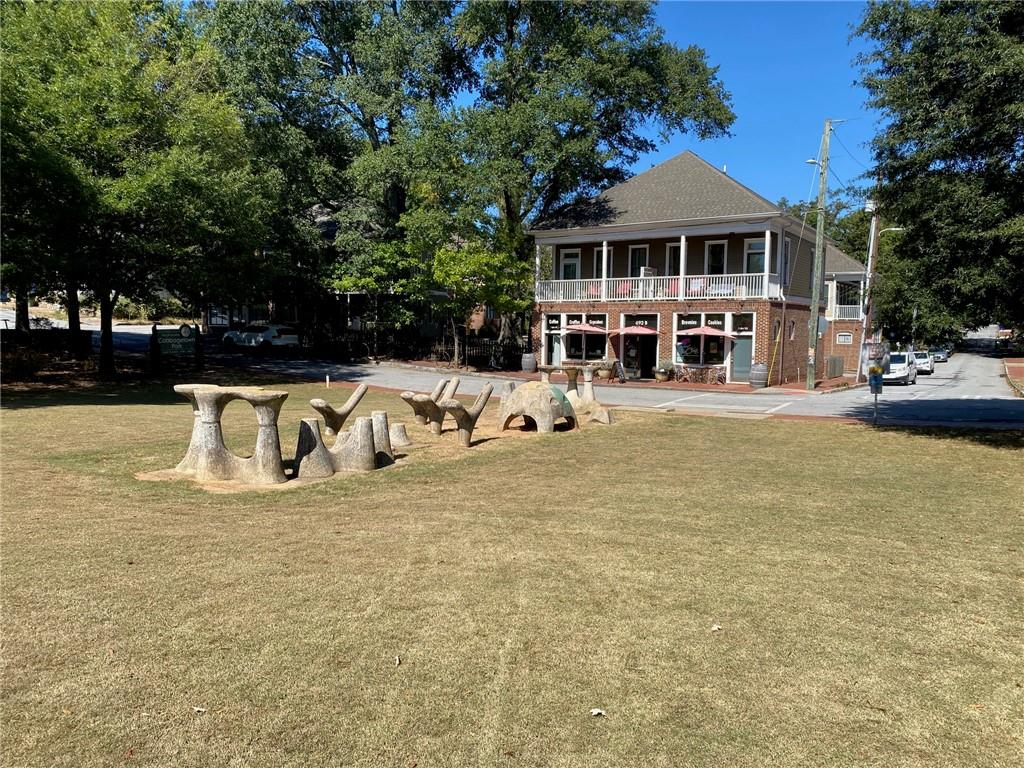 181 Powell Street Southeast, Unit 2 Atlanta, GA 30316 - Photo 35 of 47 a view of a house with pool and chairs