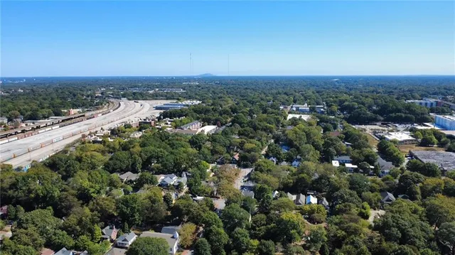 an aerial view of a houses with a yard
