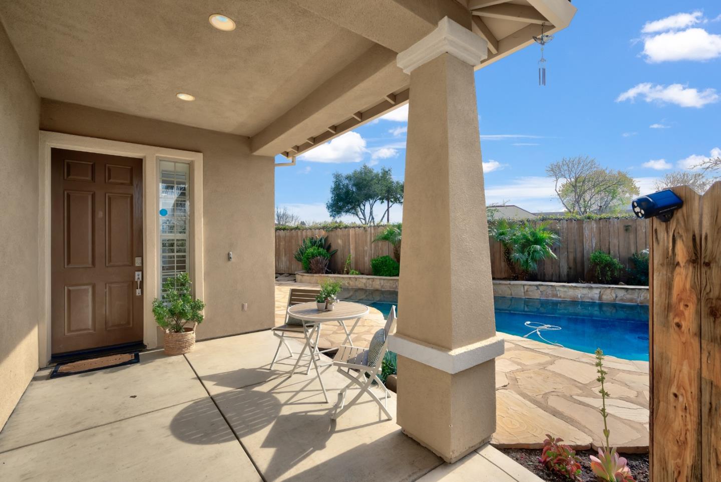 a outdoor space with patio the couches and table with garden view