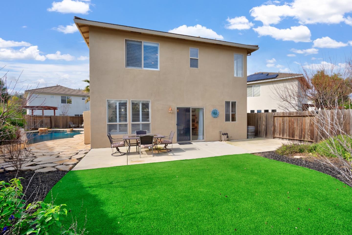 8850 Morey Way Gilroy, CA 95020 - Photo 31 of 34 a view of a backyard with sitting area