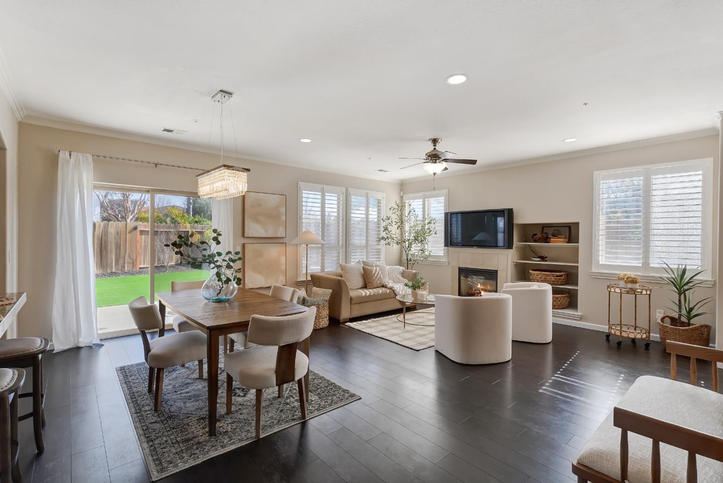 8850 Morey Way Gilroy, CA 95020 - Photo 5 of 34 a living room with fireplace furniture and a flat screen tv